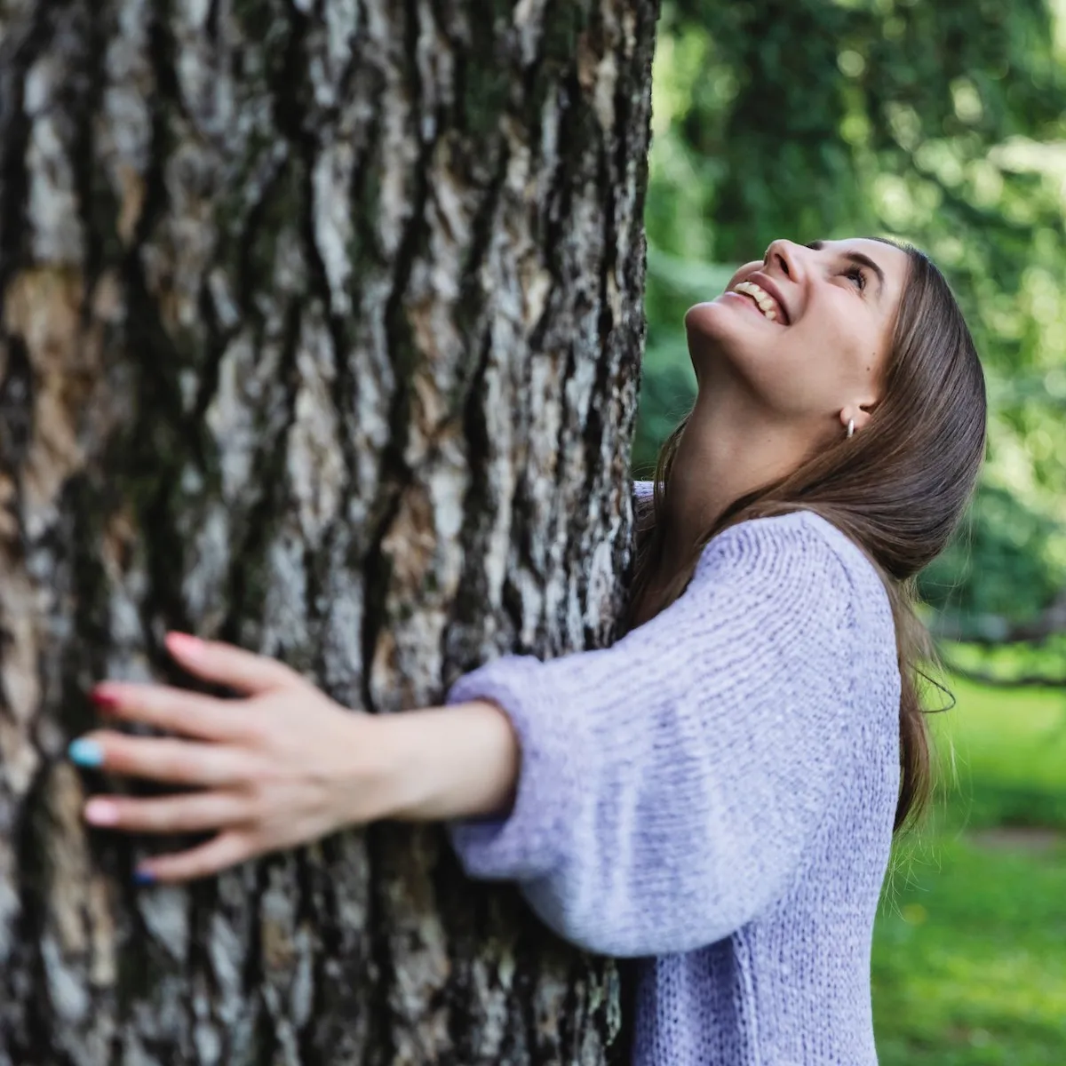 girl hugging a tree